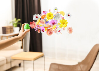 Canvas Print - Woman spraying air freshener at home, closeup. Flowered aroma