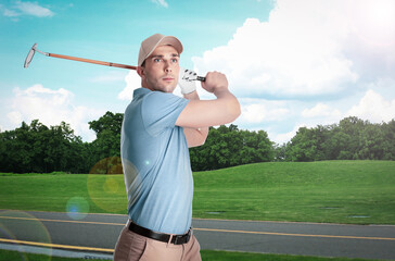 Wall Mural - Young man playing golf on course with green grass