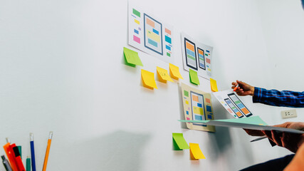 Sticker - the team of website designers with the ux ui system are writing programs and laying the layer to det