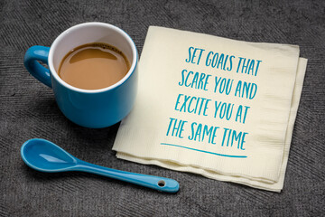 Wall Mural - set goals that scare you and excite you at the same time inspirational note, handwriting on a napkin with coffee, business, education and personal development concept