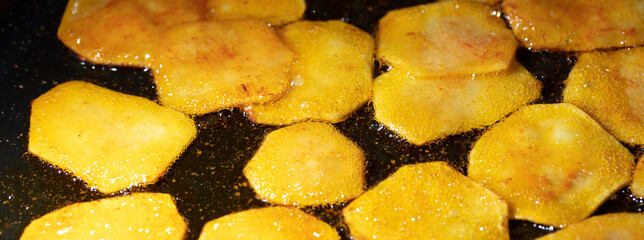 Canvas Print - Potato chips are fried in oil