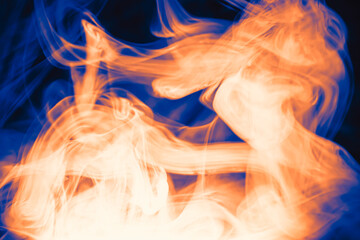 Wall Mural - clouds of colored flowing smoke on a dark background.