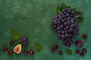 Wall Mural - Summer background with grape, figs and cherry. Top view , flat lay, copy space