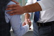 © H_Ko - Man in suit and tie give hand as hello in office closeup. Friend welcome mediation offer positive introduction thanks gesture summit executive approval motivation male arm strike bargain