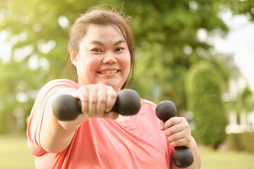 chubby happy woman exercise or yoga on green natural tropical garden at home for new normal condition after Corona epidemic.weight woman go on diet activity fitness for good health and strong health