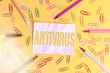 Wall Mural - Writing note showing Antivirus. Business concept for suitable for the detection and removal of computer viruses Flat lay above empty paper with pencils and paper clips