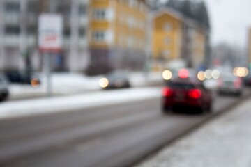 Sticker - Blurry shot of a lot of cars driving on the street covered with snow