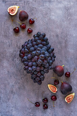 Wall Mural - Summer background with grape, figs and cherry. Top view , flat lay, copy space