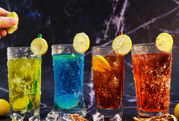 Poster - Refreshing summer drinks with alcohol on wood table and cool drinks with lemonade