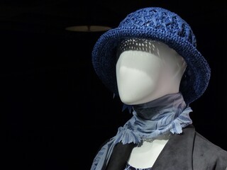 Canvas Print - Closeup shot of a mannequin wearing classy clothes and a blue hat