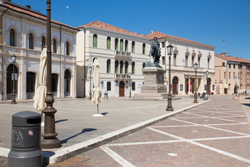 Wall Mural - Italian city of Rovigo with empty Garibaldi square in a sunny summer day