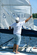 © Yurii Zushchyk - Yachtsman setting sail of yacht before race