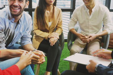 Group of young diverse people meeting in casual style in the office All laughing and smiling while planning their work Working lifestyle and team building concept