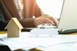 © i am way - Business sales representative working on desk in office with sunlight