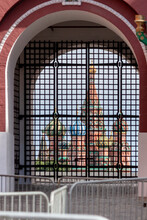 Saint Basil's Cathedral Is Visible Through Blurred Lattice Of Closed Metal Gates. Clouds On The Sky. Theme Of Censorship And Restrictions In Russia.