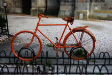 Old Orange Bicycle On Display