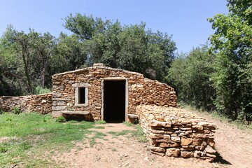 Wall Mural - Old and typical stone hut called caborne in french language in Saint Cyr au Mont d'or, France
