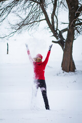 The beautiful blonde girl in red hat in the forest. Girl in winter. White snow. Little Red Riding Hood. 