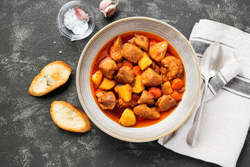 Wall Mural - Pork meat stewed with potatoes, carrots and spices (hungarian goulash).