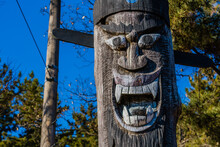 Carved Face Of Wooden Totem Pole