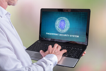 Wall Mural - Fingerprint security system concept on a laptop