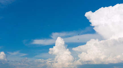 Wall Mural - White clouds on blue sky background.