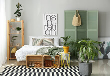 Stylish Interior Of Bedroom With Houseplants