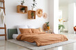 © Pixel-Shot - Stylish interior of bedroom with houseplants