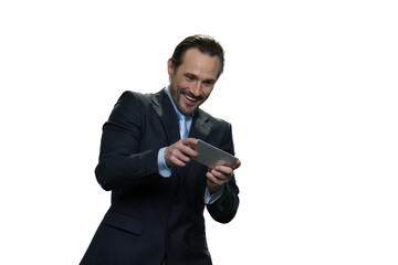 Portrait of smiling man using smartphone isolated on white background. Laughing joyful man with mobile phone.