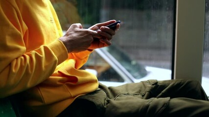 Young man hands using modern smartphone gadget traveling by city bus. Navigation app offline. Tapping device screen. Internet searching online. Tourist connecting 3G 5G. Urban freelance lifestyle.