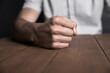© Daniel - angry man fists on table