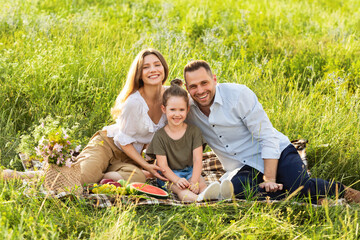 Wall Mural - Happy family spending time together on a picnic outdoor