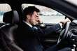 © Prostock-studio - Sad businessman driving alone in his new car