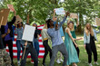 © Roman - american youth holding a sign protesting the laws against marijuana usage. outdoors. activists during manifestation, protest