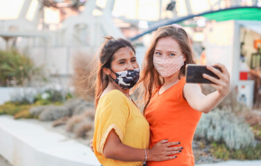 Multiracial friends taking a selfie - Pretty women enjoying the holidays