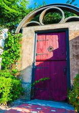 Red Door On Stone Gate In The Historic District, St. Augustine, Florida, USA