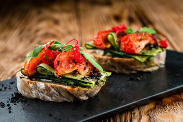 Canvas Print - bruschetta with tomato and cucumber