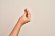 © Krakenimages.com - Hand of caucasian young man showing fingers over isolated white background doing Italian gesture with fingers together, communication gesture movement