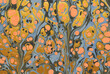 An ink marbling abstract pattern, similar to marbled ink techniques used on the inner cover linings of vintage and antiquarian books