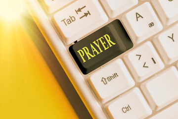 Wall Mural - Conceptual hand writing showing Prayer. Concept meaning solemn request for help or expression of thanks addressed to God Colored keyboard key with accessories arranged on copy space