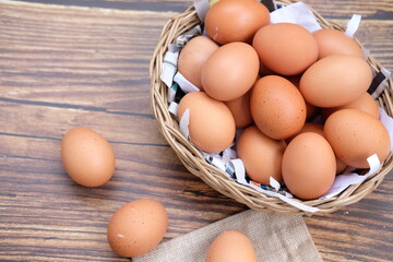 Close up chicken egg on wooden table background and space for text 