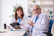 © Elnur - Old male doctor radiologist and his young female assistant in th