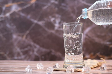 Wall Mural - pouring water into glass