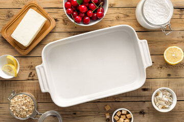 Poster - Baking dish with ingredients for cooking cherry pie on wooden table top view