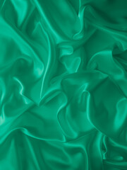 Wall Mural - Beautiful elegant wavy emerald green satin silk luxury cloth fabric texture, abstract background design. Card or banner.