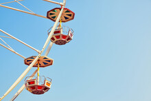 Retro Toned Close Up Picture Of Two Ferris Wheel Cars With Cloudless Sky, Space For Text.