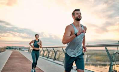 Wall Mural - Couple doing sport on the street