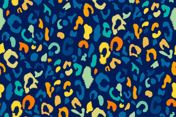 Leopard seamless pattern in bright blue, yellow, orange colors. Spotted texture. Trendy animal print in vintage style. Retro design. Hand drawn vector illustration.