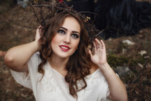 Beautiful Mystery Gothic Woman In Long White Dress In Autumn Forest.