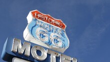 Motel Retro Sign On Historic Route 66 Famous Travel Destination, Vintage Symbol Of Road Trip In USA. Iconic Lodging Signboard In Arizona Desert. Old-fashioned Neon Signage. Classic Tourist Landmark